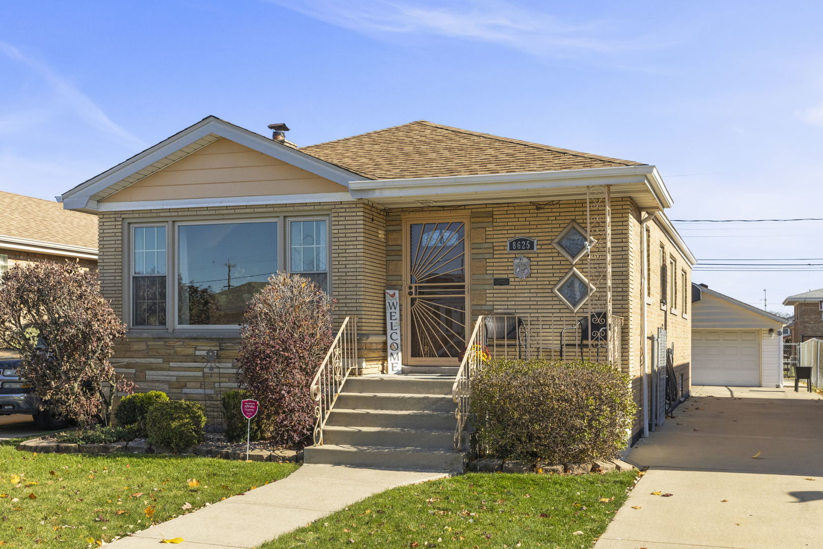 a front view of a house with garden