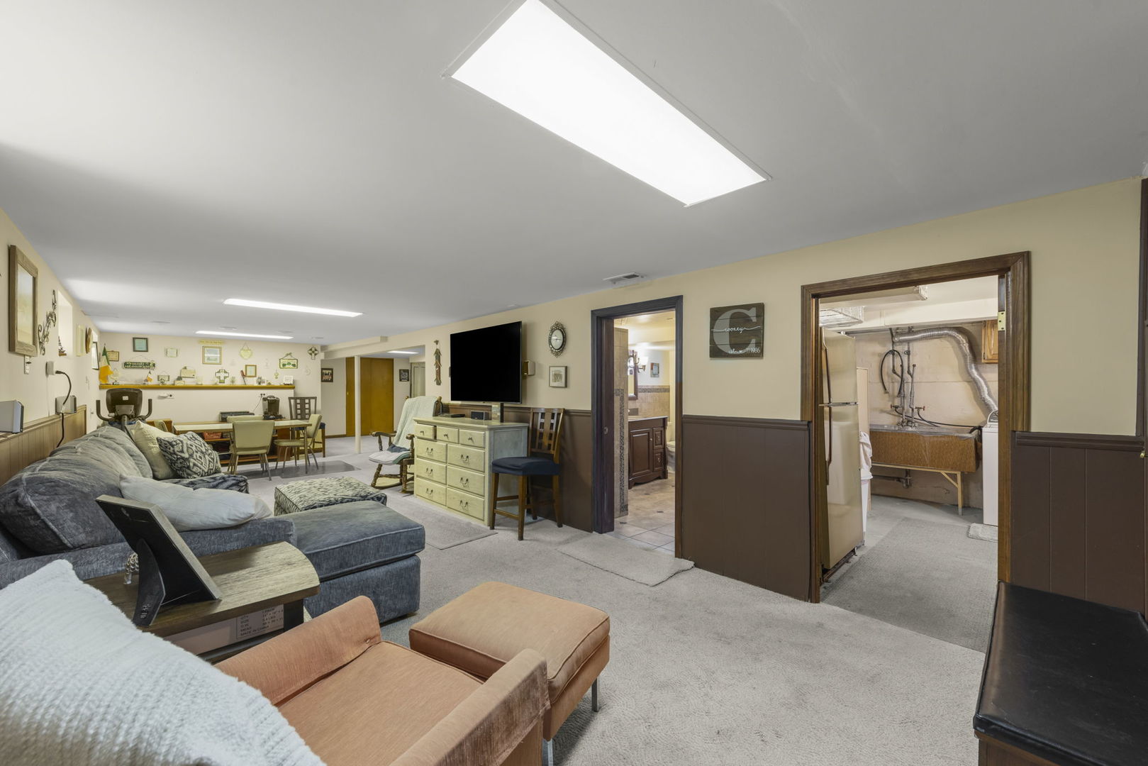 8625 South Kildare Avenue Chicago, IL 60652 - Photo 15 of 26 a living room with furniture and a flat screen tv