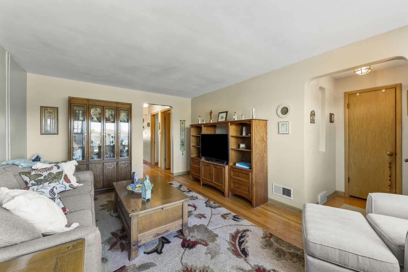 8625 South Kildare Avenue Chicago, IL 60652 - Photo 4 of 26 a living room with furniture and a flat screen tv