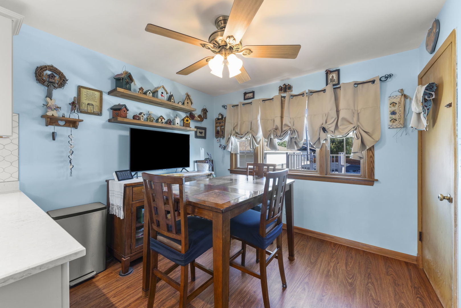 8625 South Kildare Avenue Chicago, IL 60652 - Photo 9 of 26 a view of a dining room with furniture and wooden floor