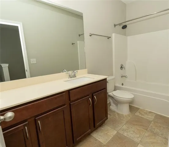 a bathroom with a sink a mirror and a bathtub