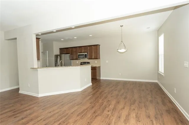 a view of a kitchen with a wooden floor