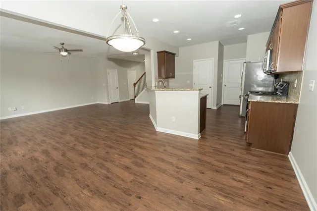 a kitchen with a sink stove and refrigerator
