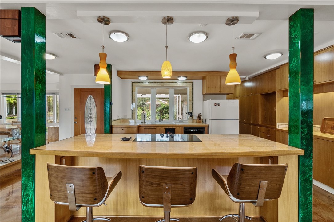 a kitchen with a table and chairs