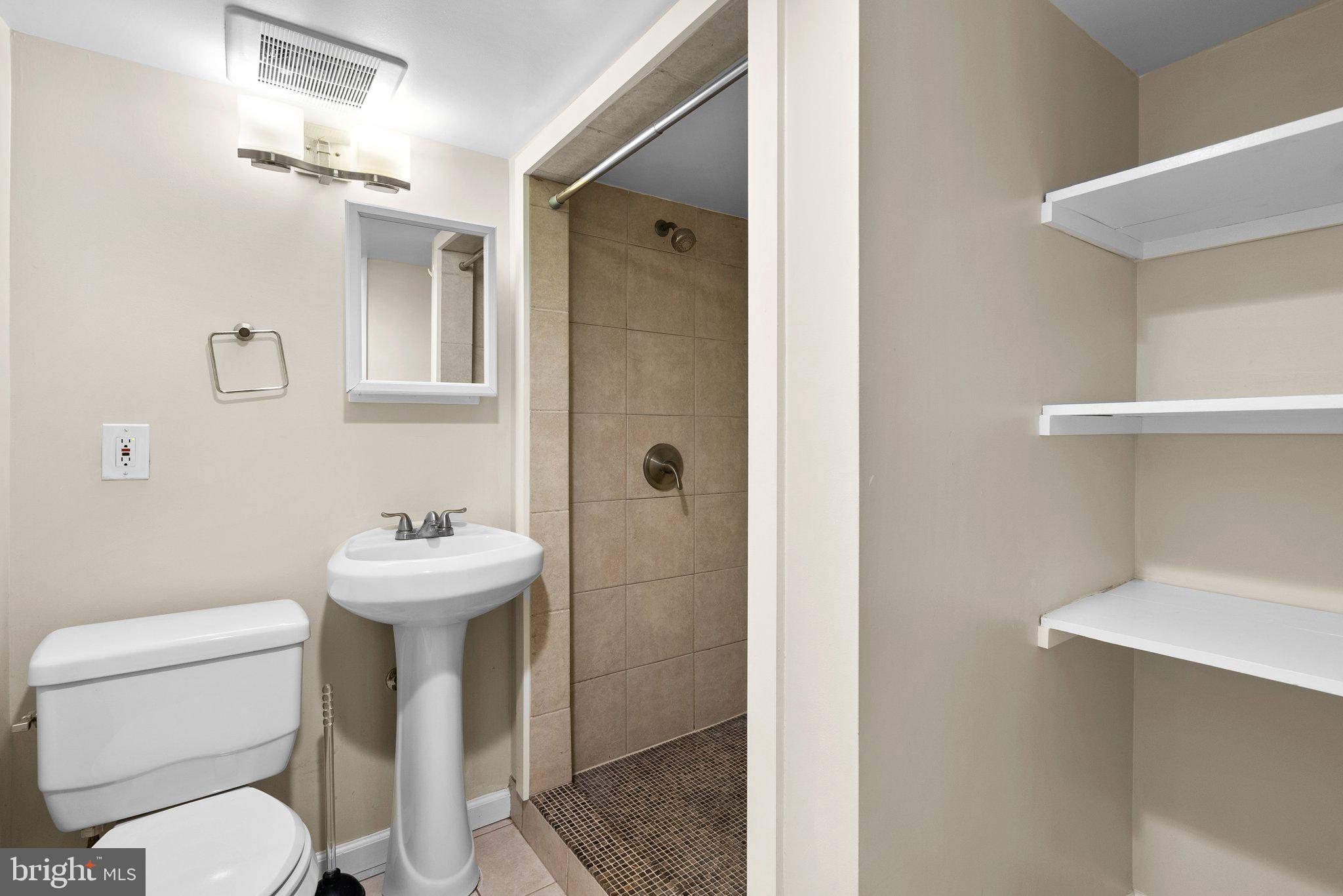 121 U Street Northeast Washington, DC 20002 - Photo 20 of 31 a bathroom with a toilet sink and shower