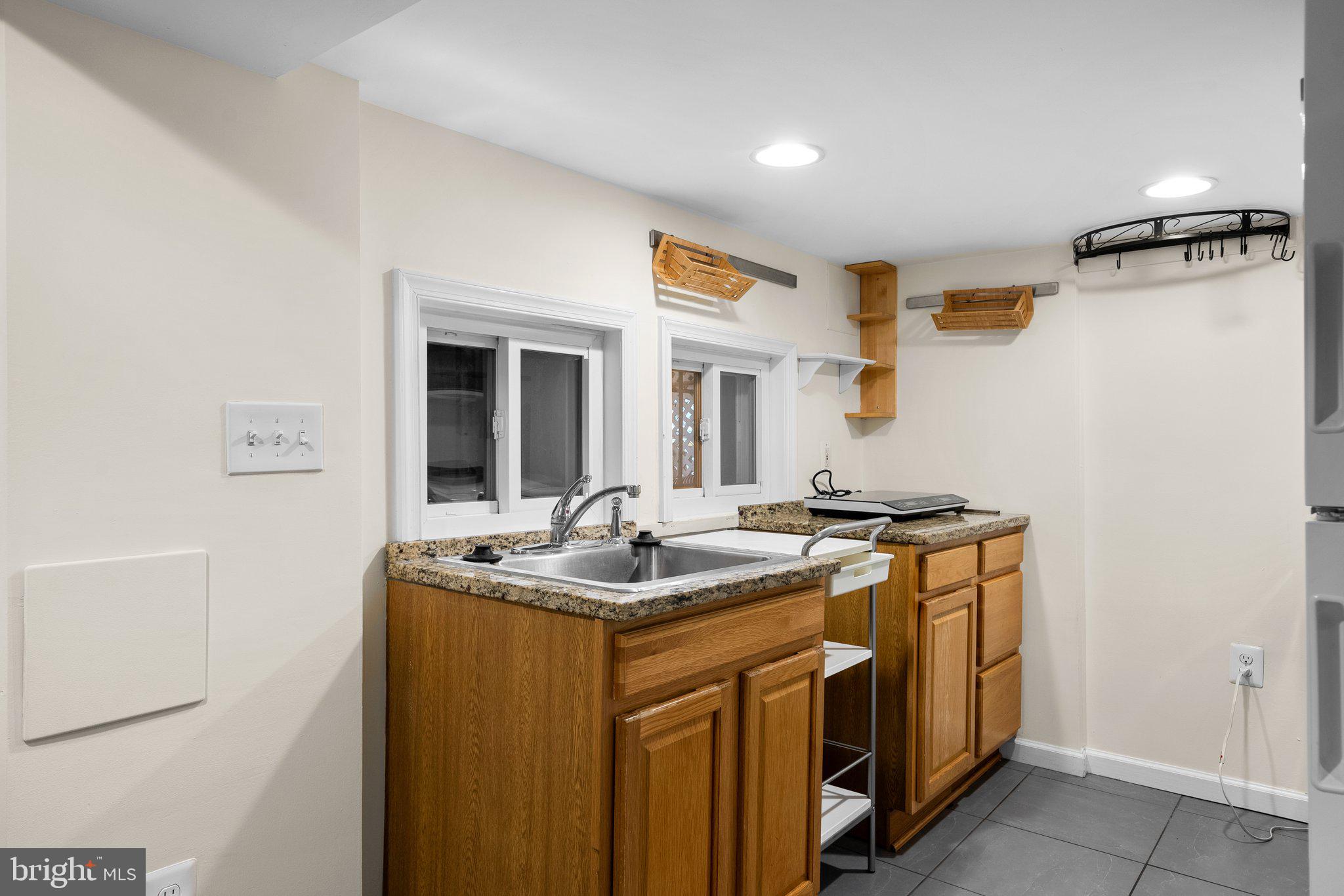121 U Street Northeast Washington, DC 20002 - Photo 22 of 31 a utility room with cabinets washer and dryer