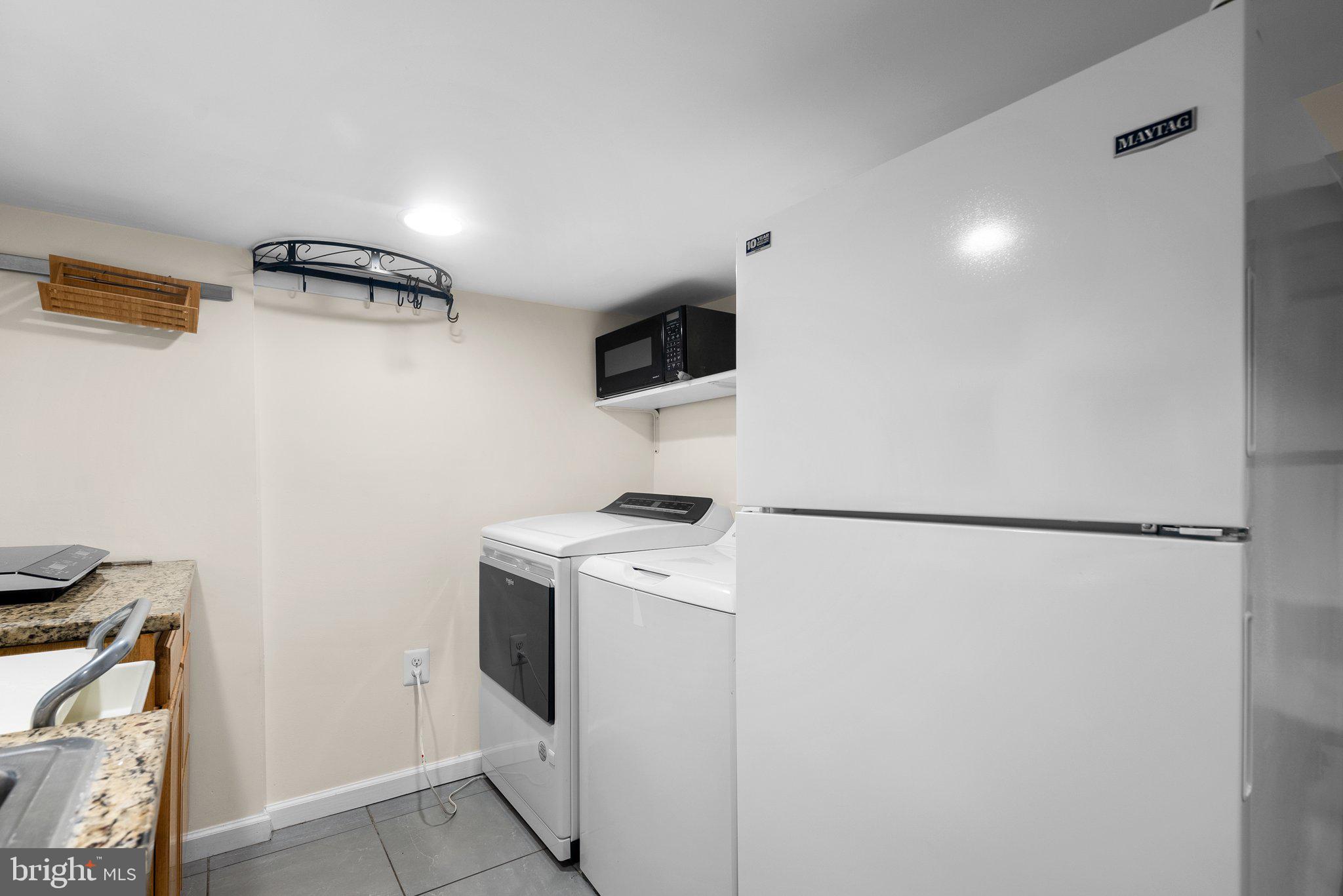 121 U Street Northeast Washington, DC 20002 - Photo 23 of 31 a utility room with dryer and washer
