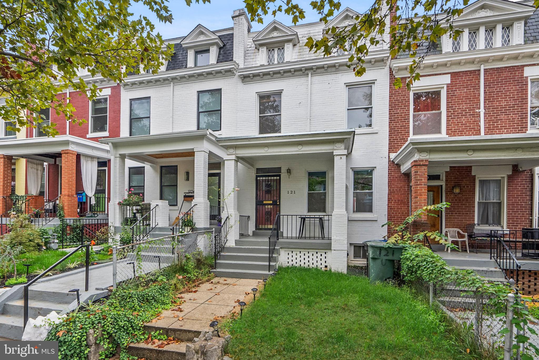 121 U Street Northeast Washington, DC 20002 - Photo 25 of 31 front view of a brick house with a yard table and chairs