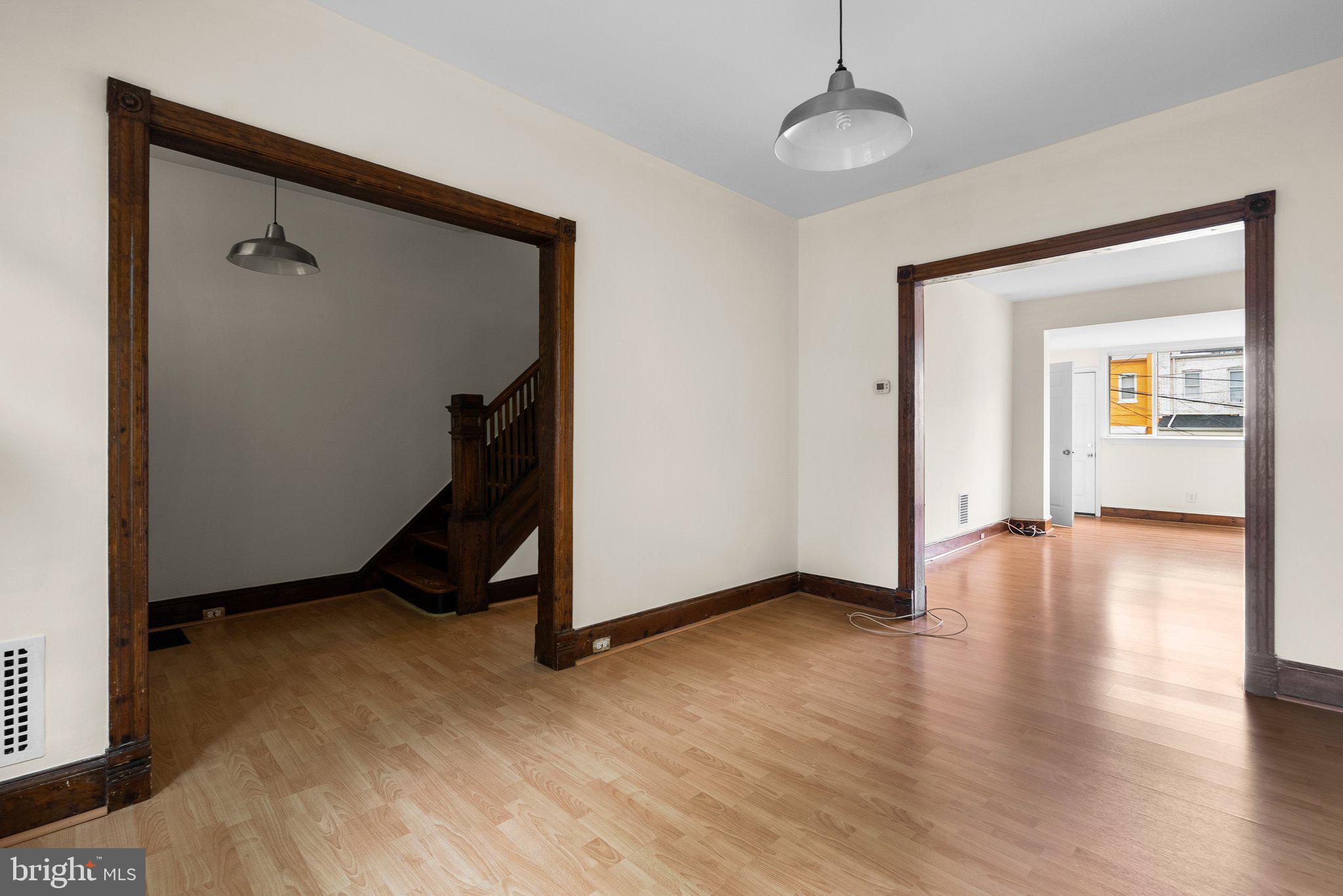121 U Street Northeast Washington, DC 20002 - Photo 3 of 31 a view of a room with wooden floor staircase and a hallway