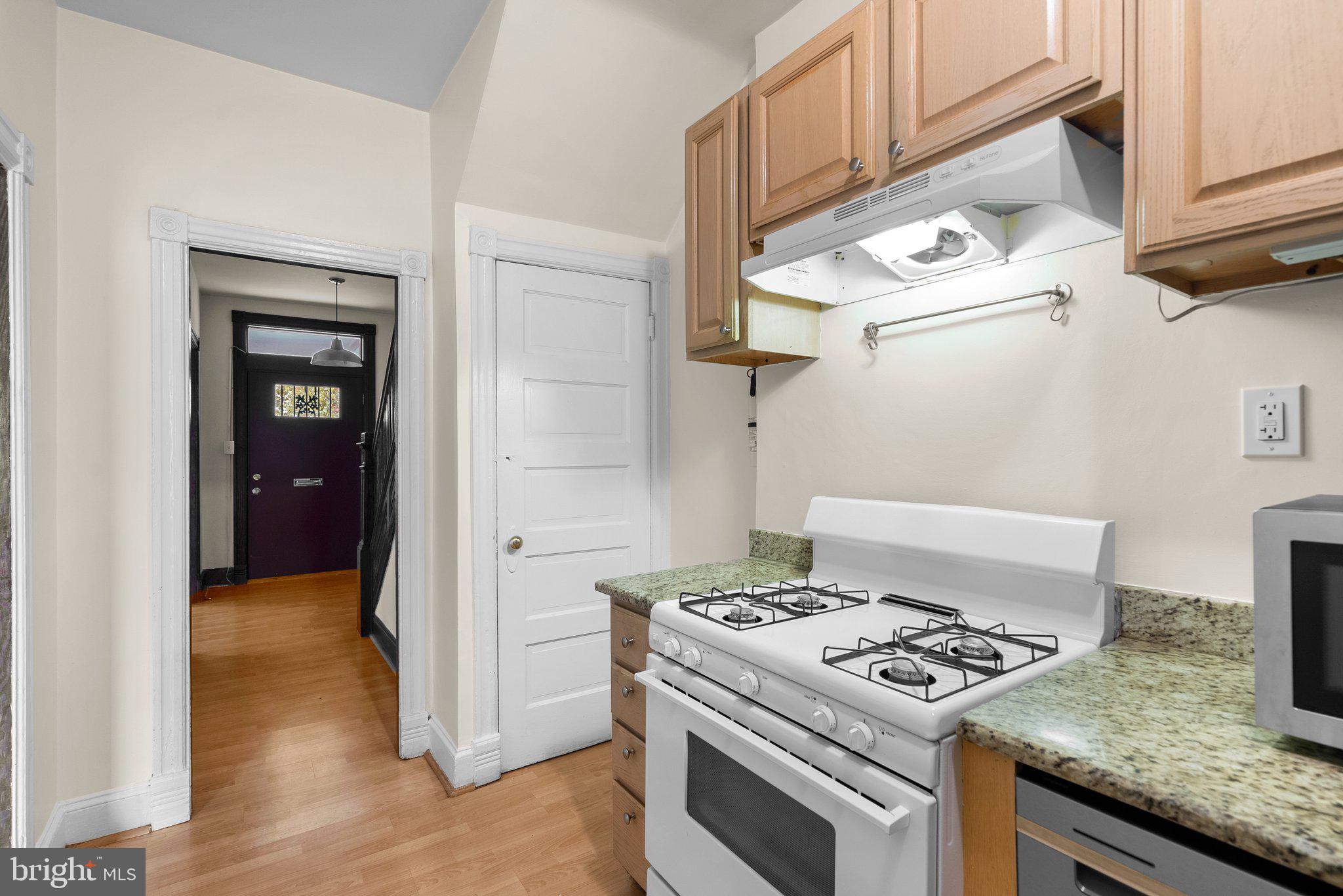 121 U Street Northeast Washington, DC 20002 - Photo 9 of 31 a kitchen with a stove and a refrigerator