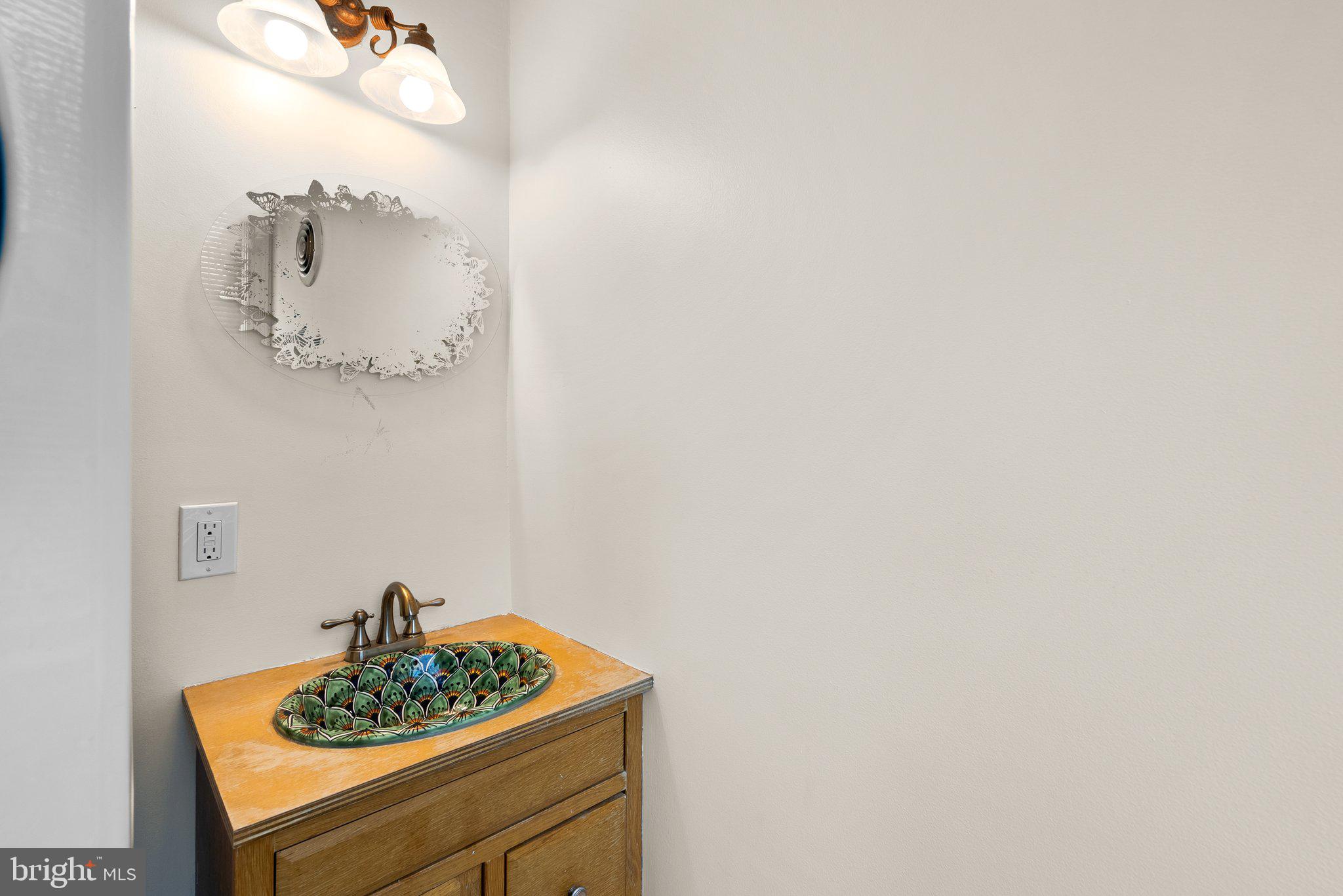 121 U Street Northeast Washington, DC 20002 - Photo 10 of 31 a bathroom with a sink and a mirror