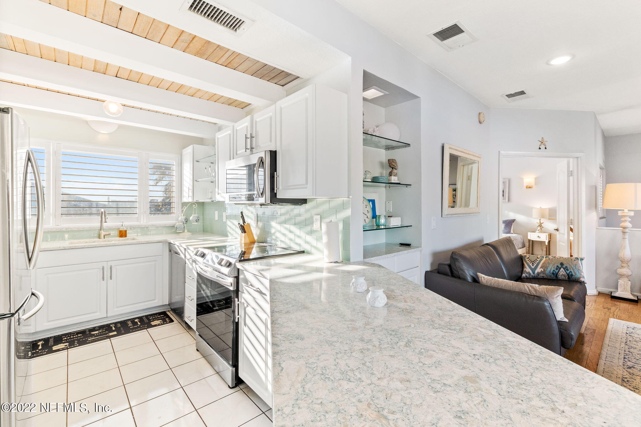 5725 Rudolph Avenue St. Augustine, FL 32080 - Photo 21 of 94 a kitchen with a stove a sink and a refrigerator