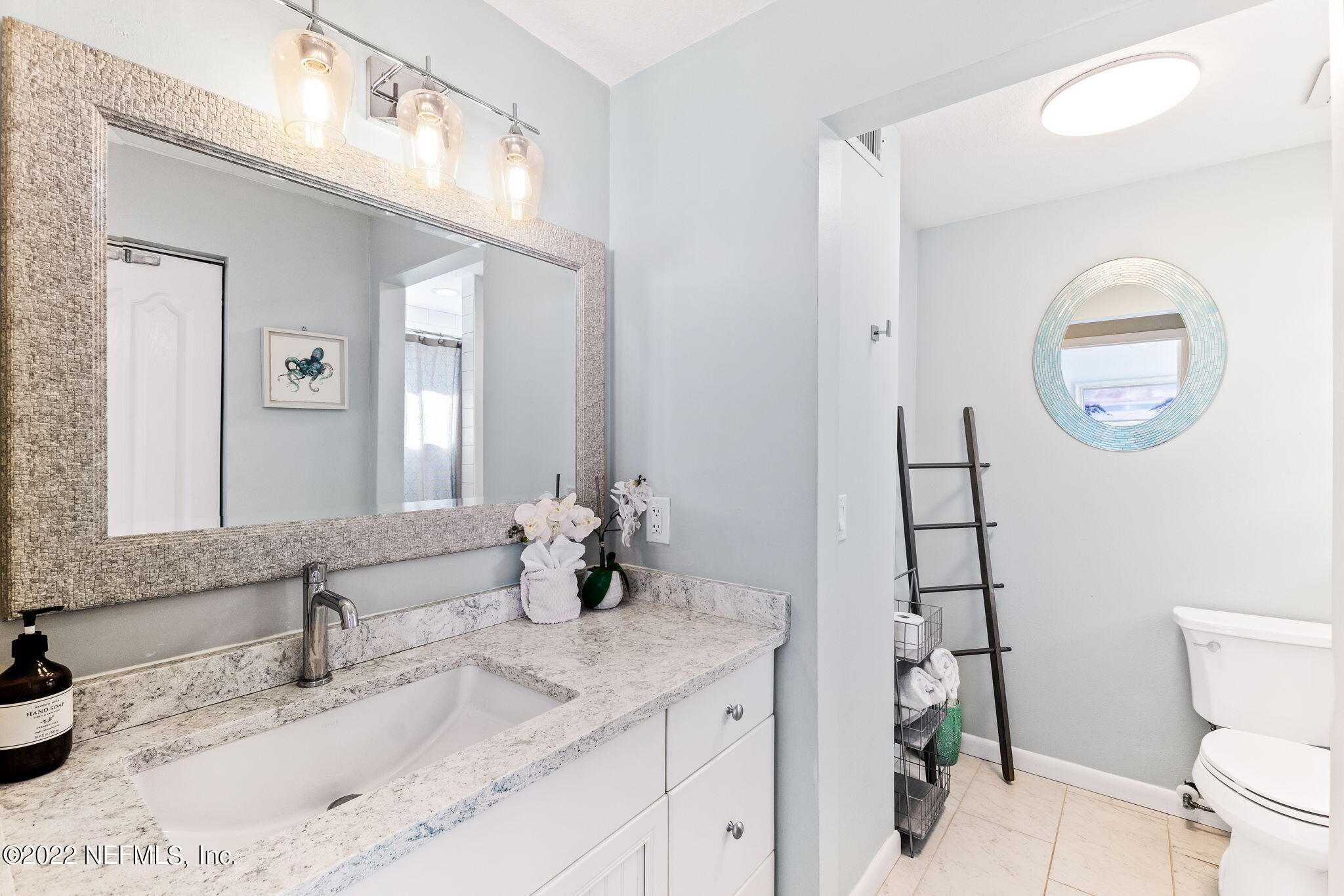 5725 Rudolph Avenue St. Augustine, FL 32080 - Photo 32 of 94 a bathroom with a granite countertop sink mirror and toilet