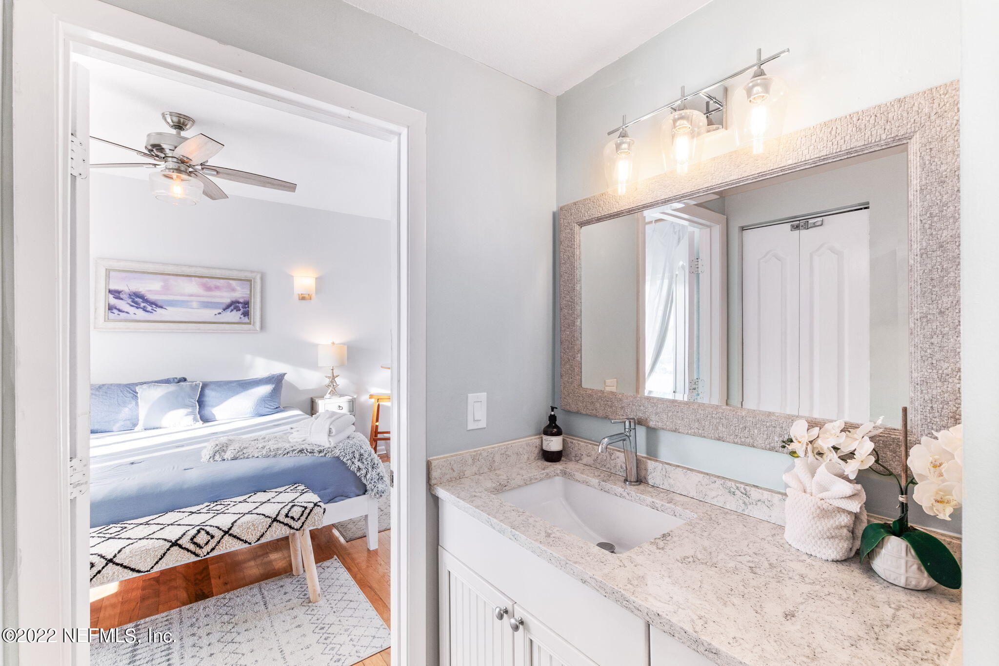 5725 Rudolph Avenue St. Augustine, FL 32080 - Photo 34 of 94 a bathroom with a granite countertop sink and a mirror