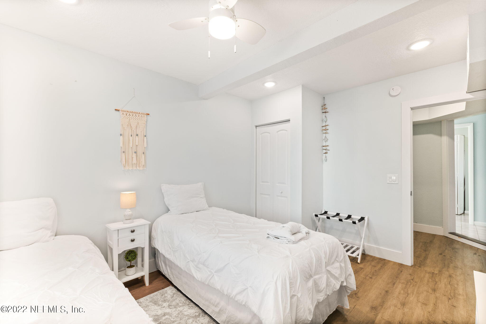 5725 Rudolph Avenue St. Augustine, FL 32080 - Photo 38 of 94 a bedroom with a bed and wooden floor