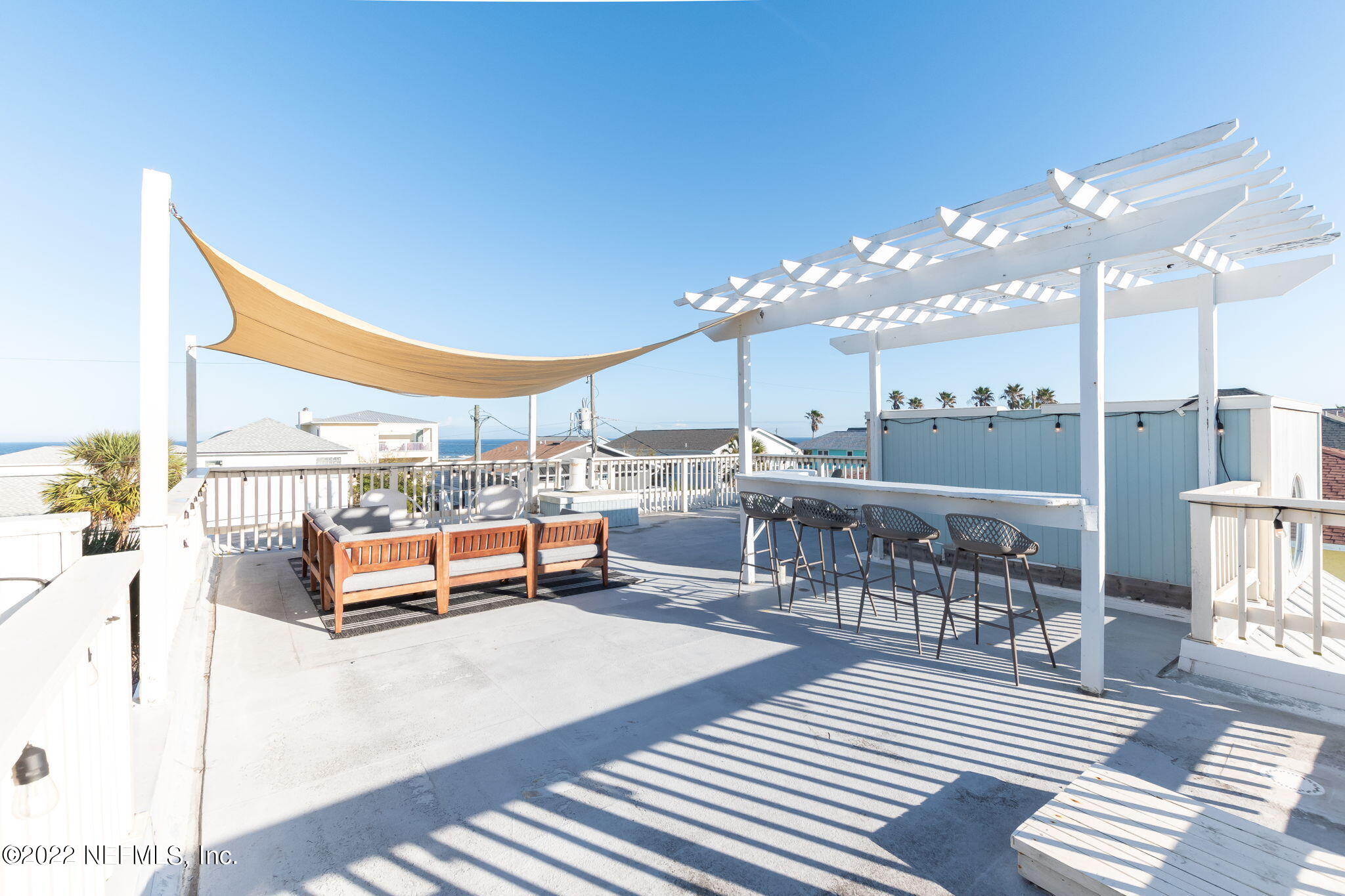 5725 Rudolph Avenue St. Augustine, FL 32080 - Photo 50 of 94 a living room with lots of furniture and view of kitchen