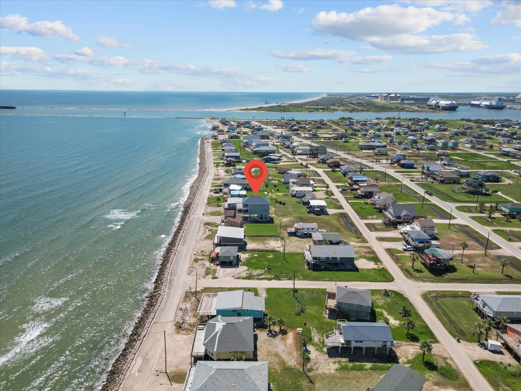718 Beach Drive Surfside Beach, TX 77541 - Photo 4 of 49 Experience breathtaking ocean views from this elevated coastal home, perfectly positioned on stilts for protection and panoramic vistas. Nestled in a tranquil beachside neighborhood, it's the ideal retreat for a serene waterfront lifestyle.