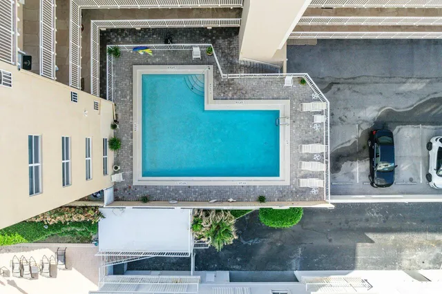a terrace with outdoor seating and city view