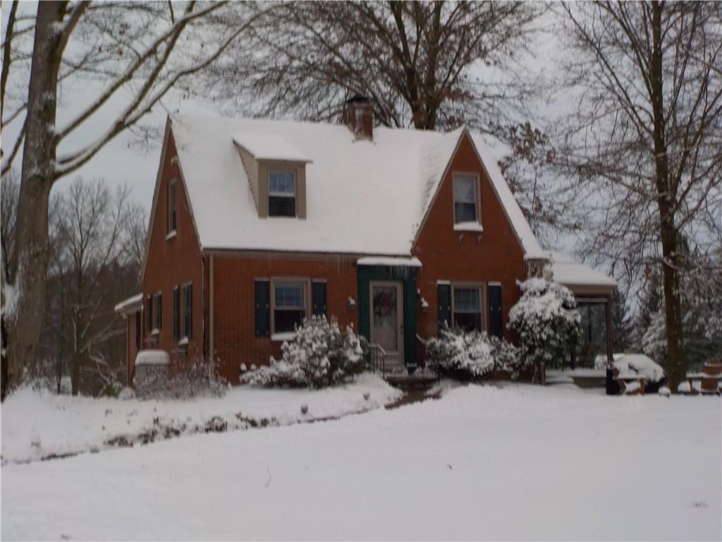 201 Sunset Road Pittsburgh, PA 15237 - Photo 1 of 11 a front view of a house with a yard covered in snow