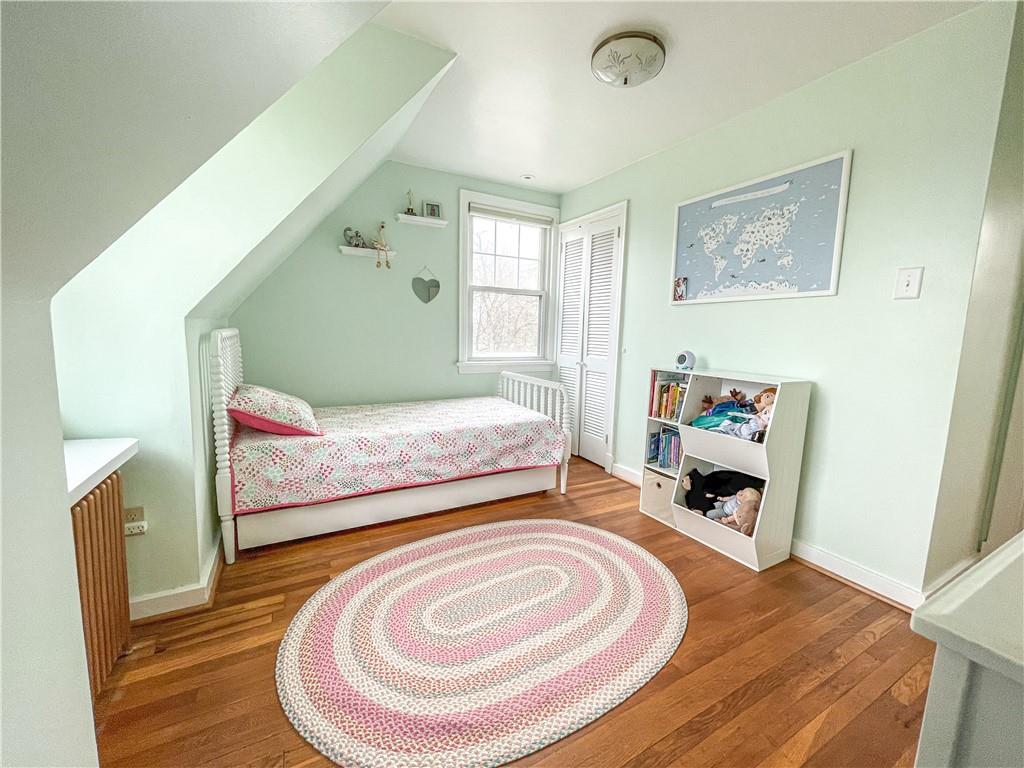 201 Sunset Road Pittsburgh, PA 15237 - Photo 11 of 11 a bedroom with a bed and wooden floor