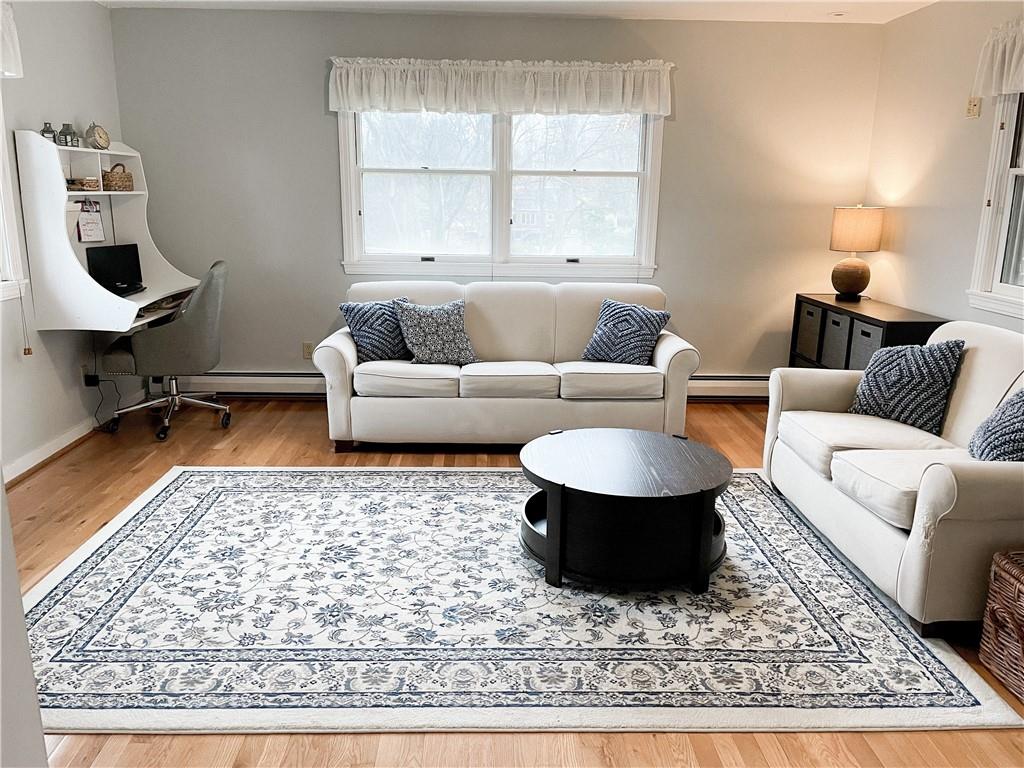 201 Sunset Road Pittsburgh, PA 15237 - Photo 7 of 11 a living room with a couch and a rug