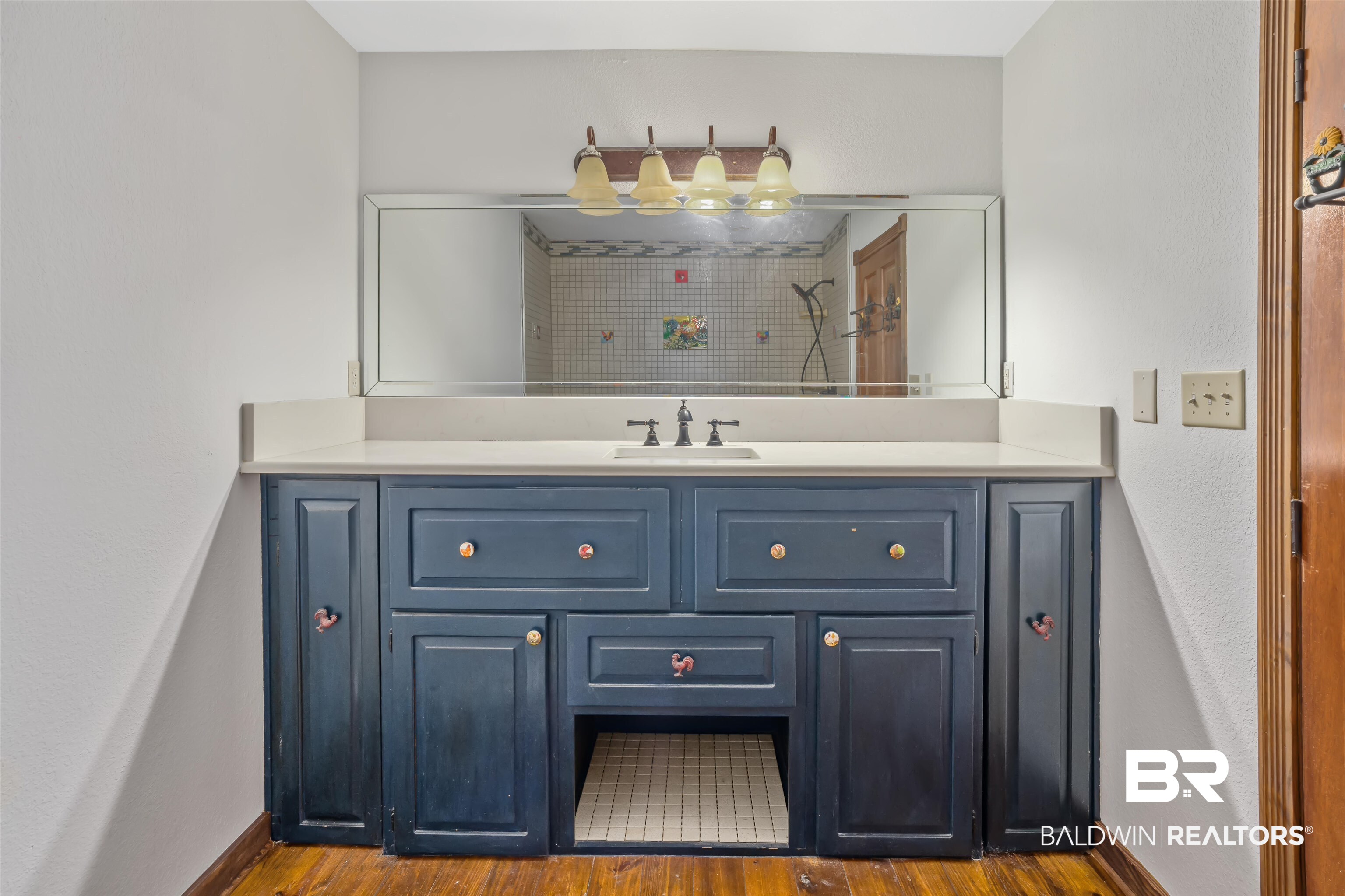 51699 Highway 31 Perdido, AL 36562 - Photo 17 of 30 Bathroom featuring vanity, baseboards, and wood finished floors