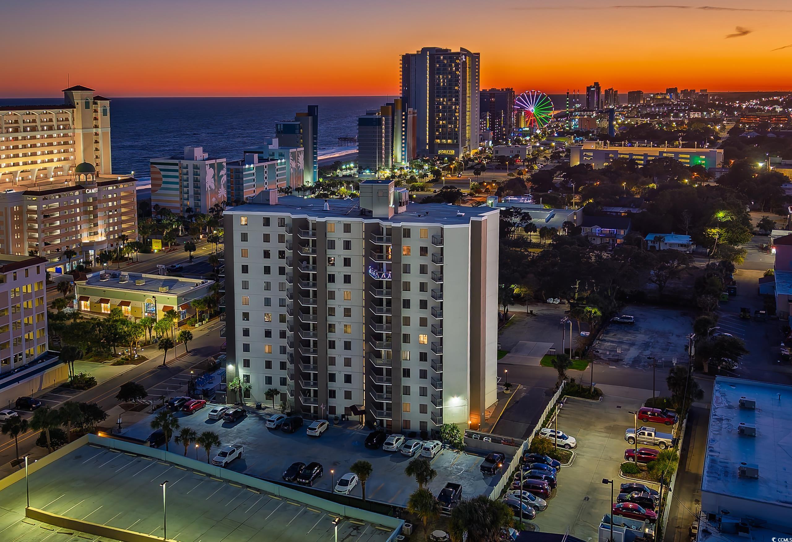 400 20th Avenue North, Unit 503 Myrtle Beach, SC 29577 - Photo 32 of 32 Aerial view at dusk of a water view and a view of city