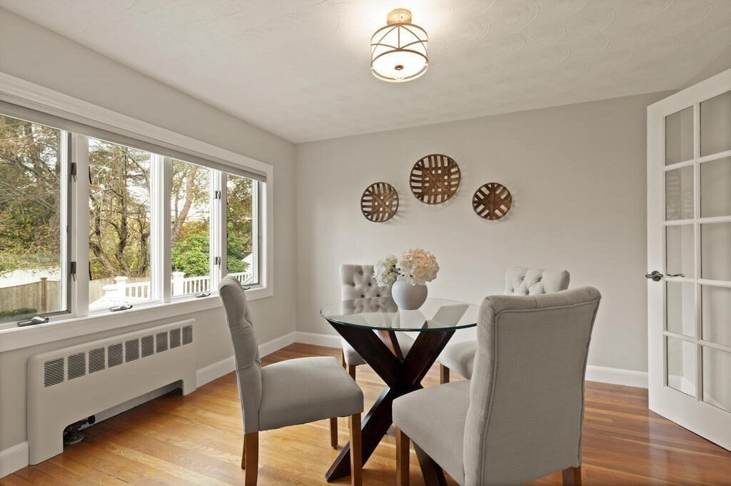 39 Nathaniel Road Winchester, MA 01890 - Photo 11 of 38 a view of a dining room with furniture window and wooden floor