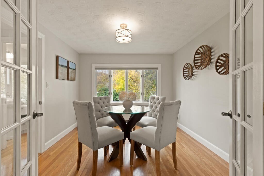 39 Nathaniel Road Winchester, MA 01890 - Photo 12 of 38 a view of a dining room with furniture and a window