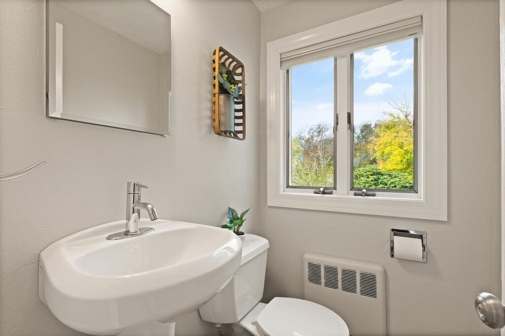 39 Nathaniel Road Winchester, MA 01890 - Photo 15 of 38 a white sink sitting next to a white toilet