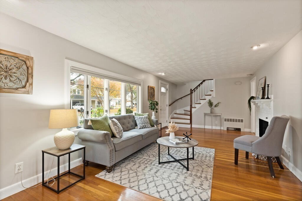 39 Nathaniel Road Winchester, MA 01890 - Photo 16 of 38 a living room with furniture and a large window