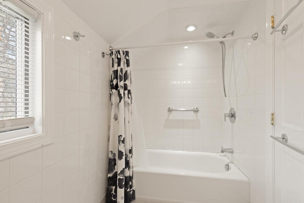 39 Nathaniel Road Winchester, MA 01890 - Photo 21 of 38 a bathroom with a bathtub and a shower