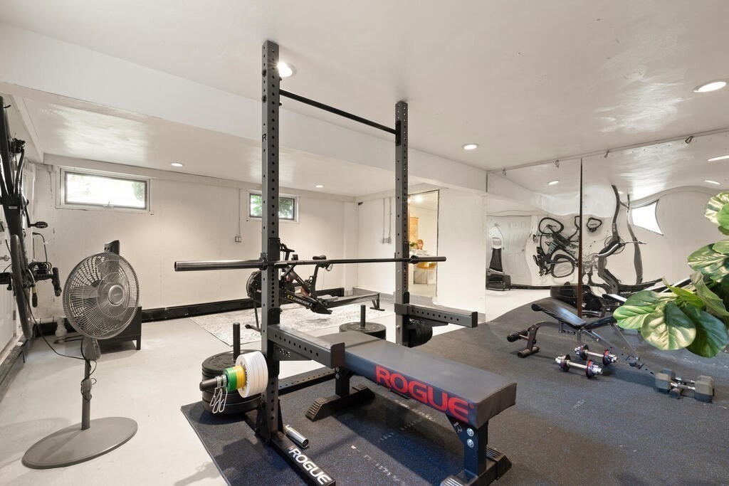 39 Nathaniel Road Winchester, MA 01890 - Photo 23 of 38 a room with gym equipment and a view of living room