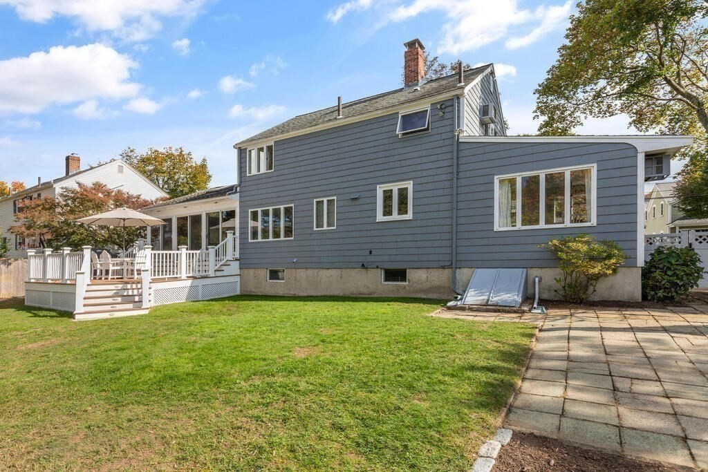 39 Nathaniel Road Winchester, MA 01890 - Photo 26 of 38 a front view of a house with a yard