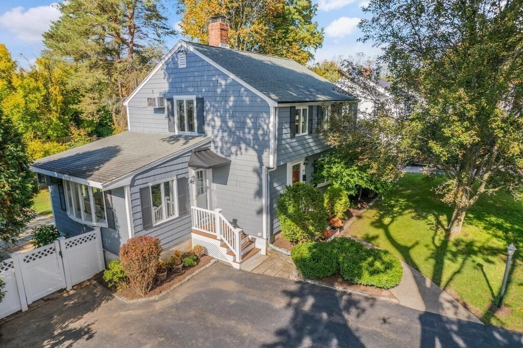39 Nathaniel Road Winchester, MA 01890 - Photo 31 of 38 a front view of a house with a garden and plants