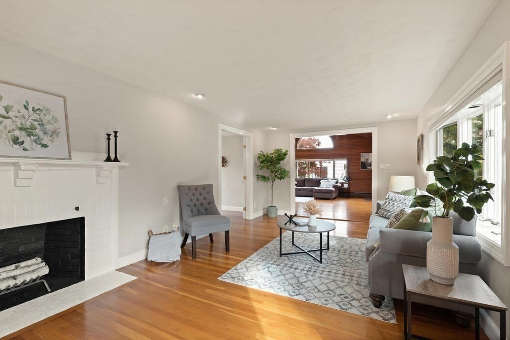 39 Nathaniel Road Winchester, MA 01890 - Photo 4 of 38 a living room with furniture and a fireplace