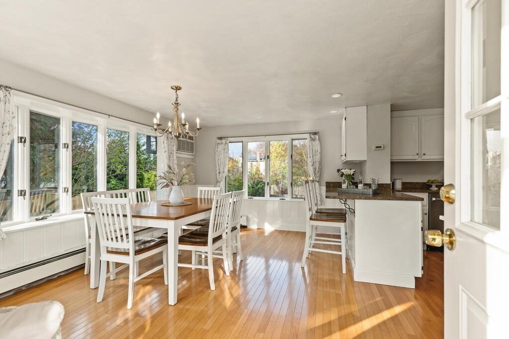 39 Nathaniel Road Winchester, MA 01890 - Photo 8 of 38 a view of a dining room with furniture wooden floor and chandelier