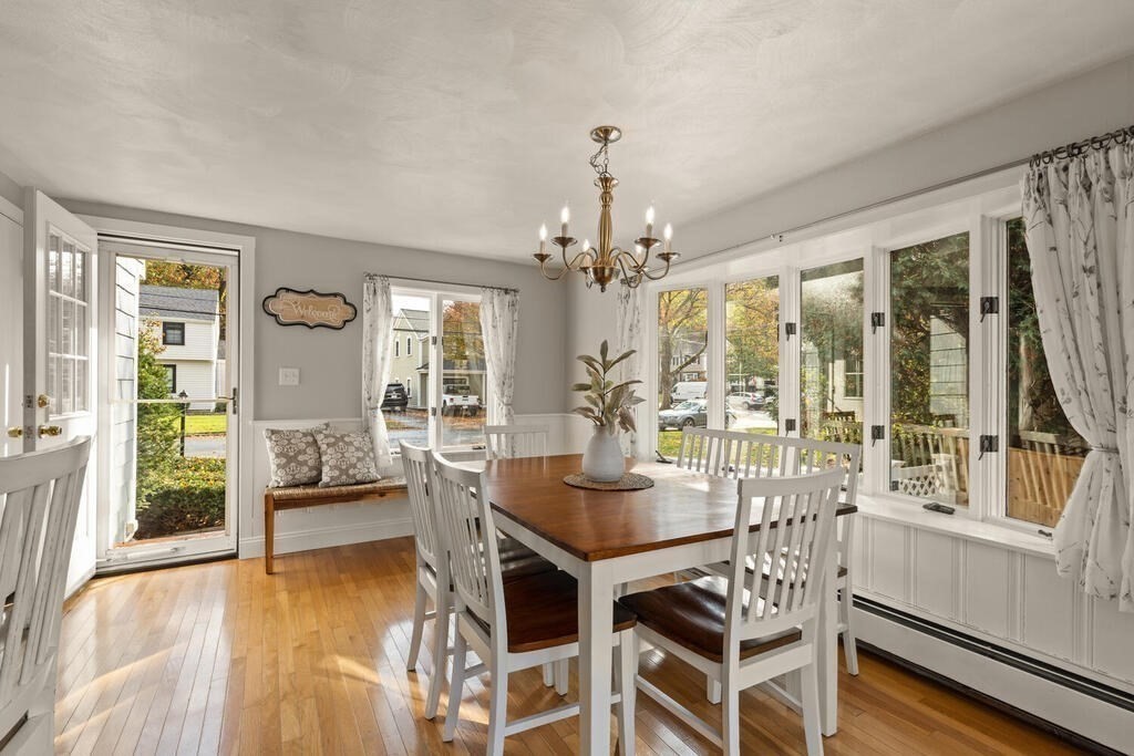 39 Nathaniel Road Winchester, MA 01890 - Photo 9 of 38 a view of a dining room with furniture wooden floor and chandelier
