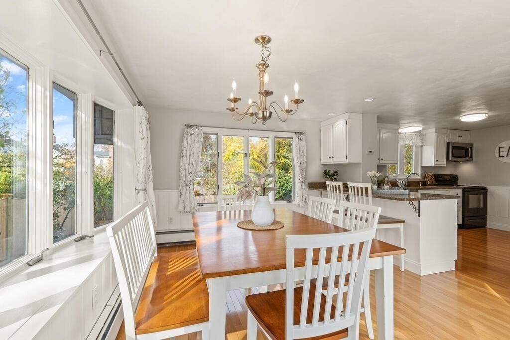 39 Nathaniel Road Winchester, MA 01890 - Photo 10 of 38 a view of a dining room with furniture window and wooden floor