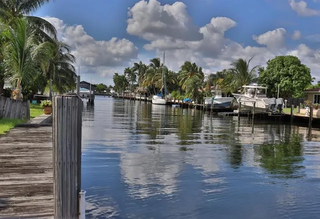 a view of a lake with houses in the back