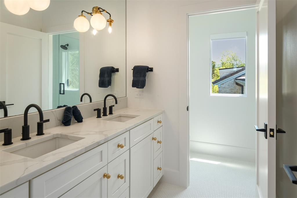 455 Sun Valley Mabank, TX 75147 - Photo 30 of 35 a bathroom with a double vanity sink and a mirror