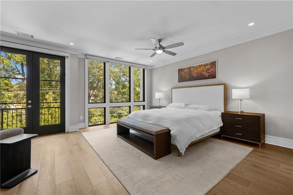 1272 Appleden Way, Unit 19 Atlanta, GA 30319 - Photo 12 of 26 a spacious bedroom with a large bed and a large window