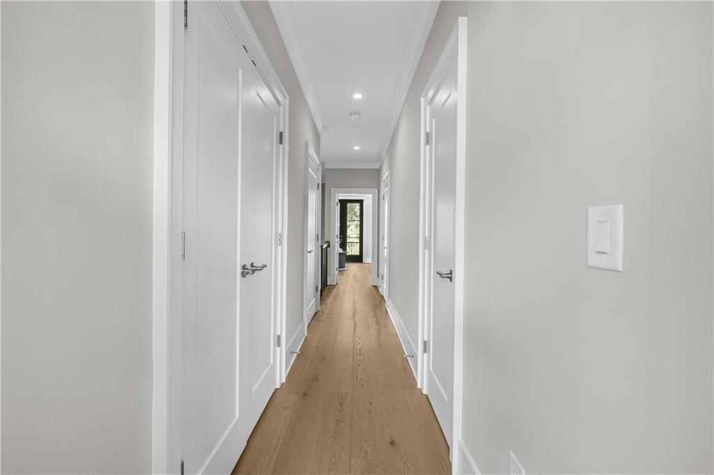 1272 Appleden Way, Unit 19 Atlanta, GA 30319 - Photo 16 of 26 a view of a hallway with a wooden floor