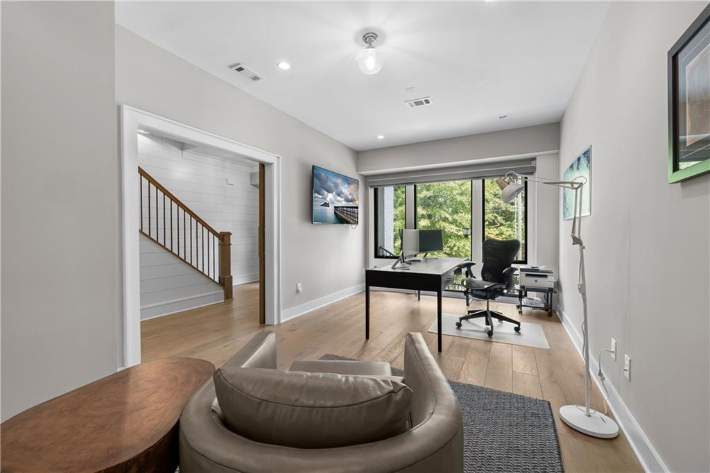 1272 Appleden Way, Unit 19 Atlanta, GA 30319 - Photo 20 of 26 a living room with furniture and a large window