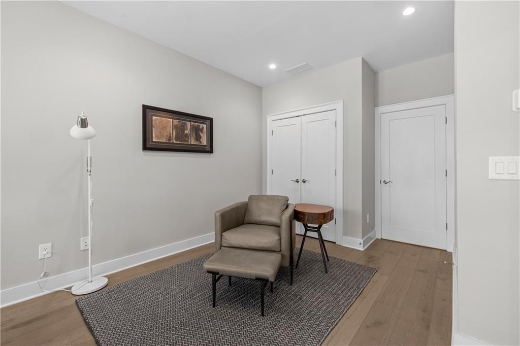 1272 Appleden Way, Unit 19 Atlanta, GA 30319 - Photo 21 of 26 a view of a livingroom with furniture and a chair