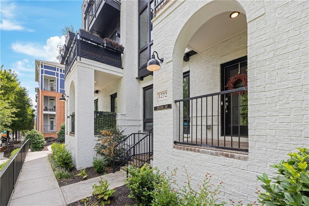 1272 Appleden Way, Unit 19 Atlanta, GA 30319 - Photo 25 of 26 a view of a brick house many windows