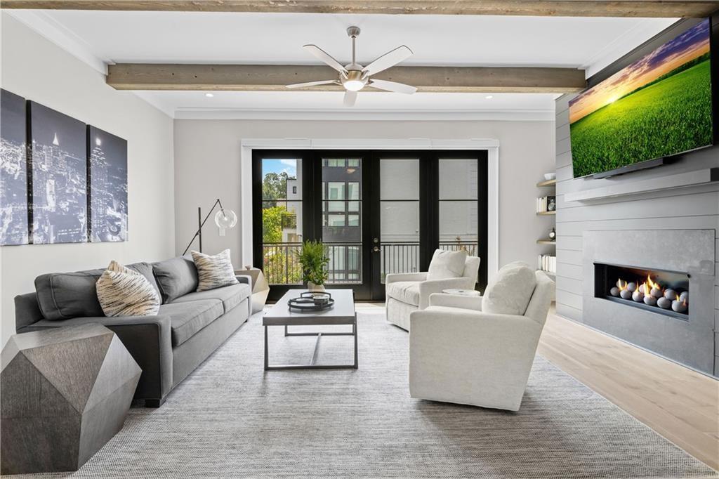1272 Appleden Way, Unit 19 Atlanta, GA 30319 - Photo 6 of 26 a living room with furniture and a large window