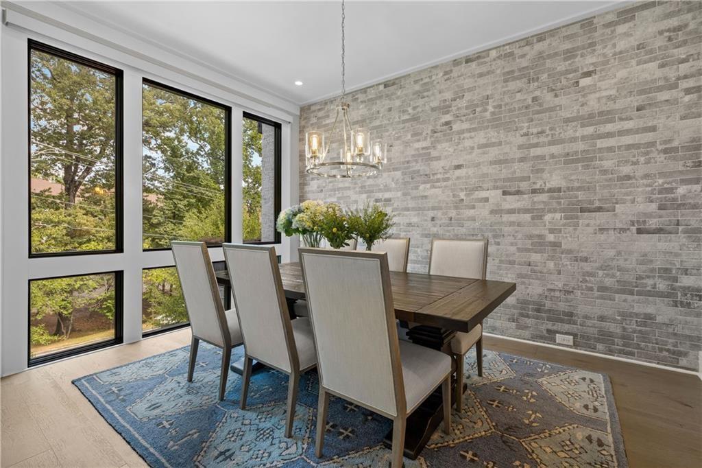 1272 Appleden Way, Unit 19 Atlanta, GA 30319 - Photo 7 of 26 a dining room with furniture and window