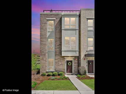 a view of a chairs and table in the city