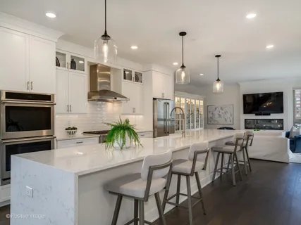 a large kitchen with a stove and a sink